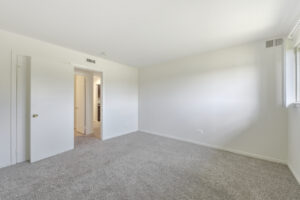 Interior Unit Bedroom, Neutral toned walls and carpeting.